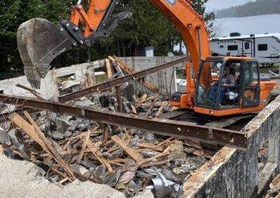 Excavator demolishing home in Shelton